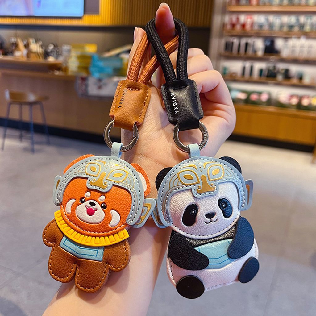 Red panda and panda leather keychain charms with Sanxingdui mask design