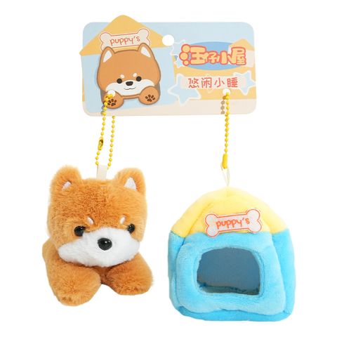Cute Shiba Inu plush puppy with removable mini house keychain charm on white background