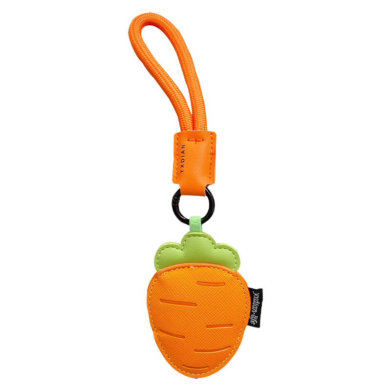 Carrot vegetable leather keychain charm on white background