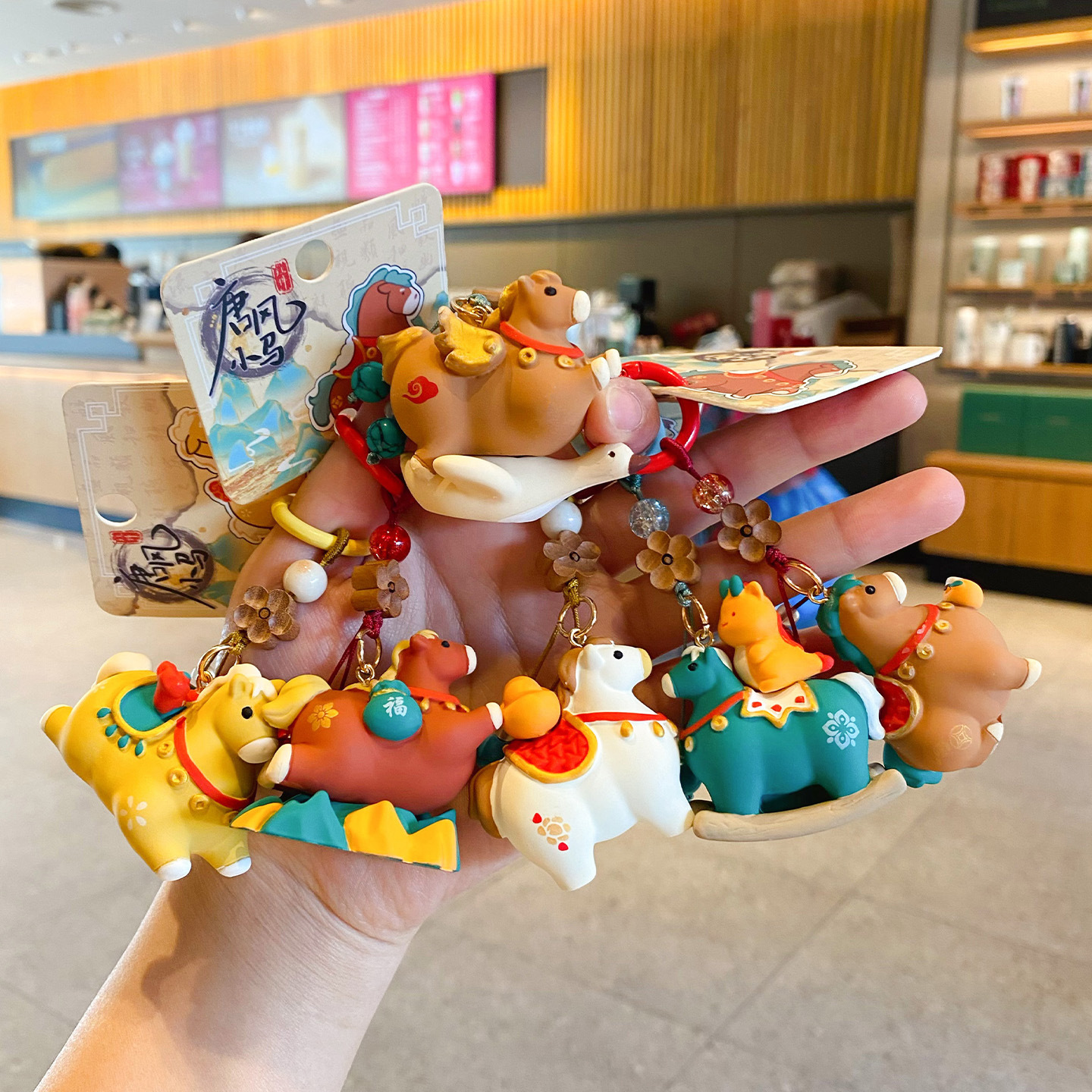 Tang-style lucky pony keychain charms featuring all six designs