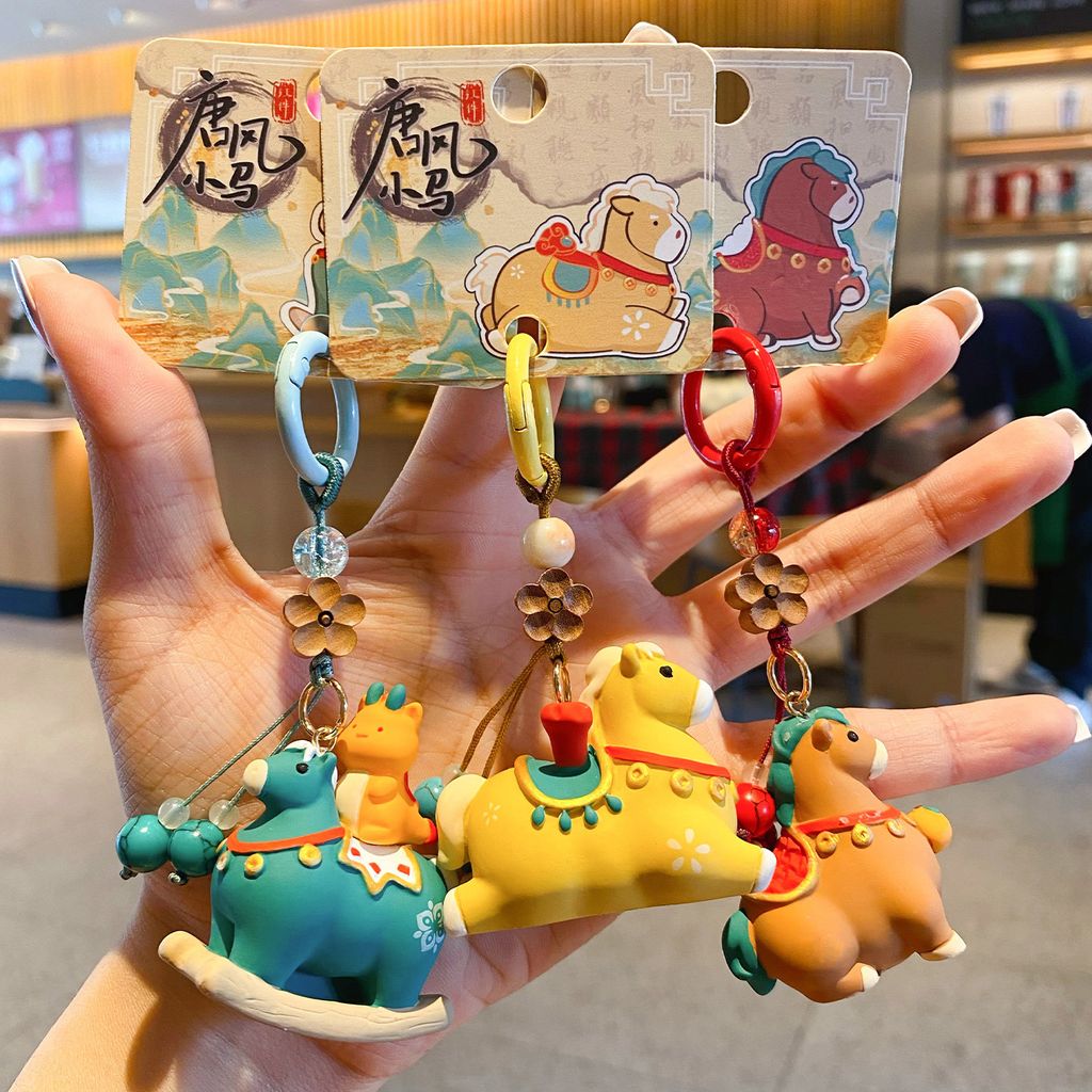 Tang-style lucky pony keychain charms featuring some of the available designs