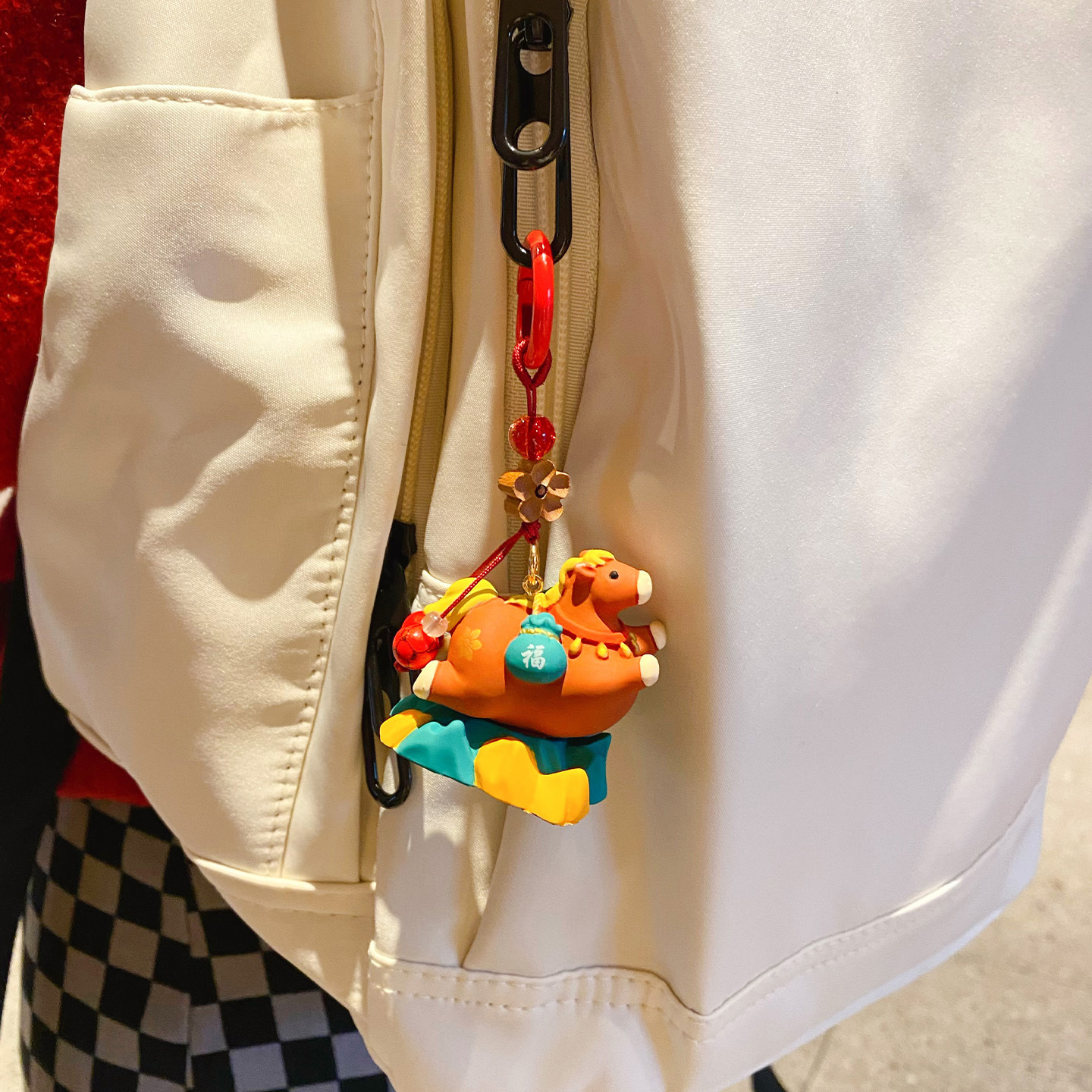 Tang-style cute smooth-sailing pony keychain charm hanging on a bag