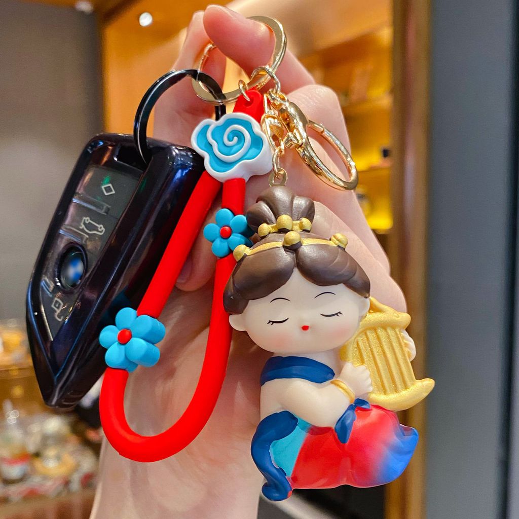 Dunhuang Flying Apsara keychain charm in konghou style attached to a car key fob
