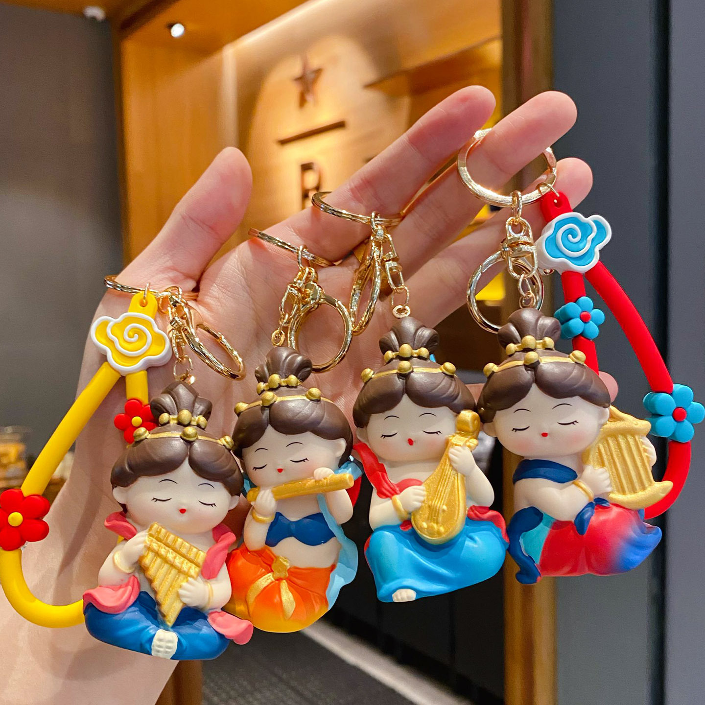 Dunhuang Flying Apsara keychain charms featuring all four designs