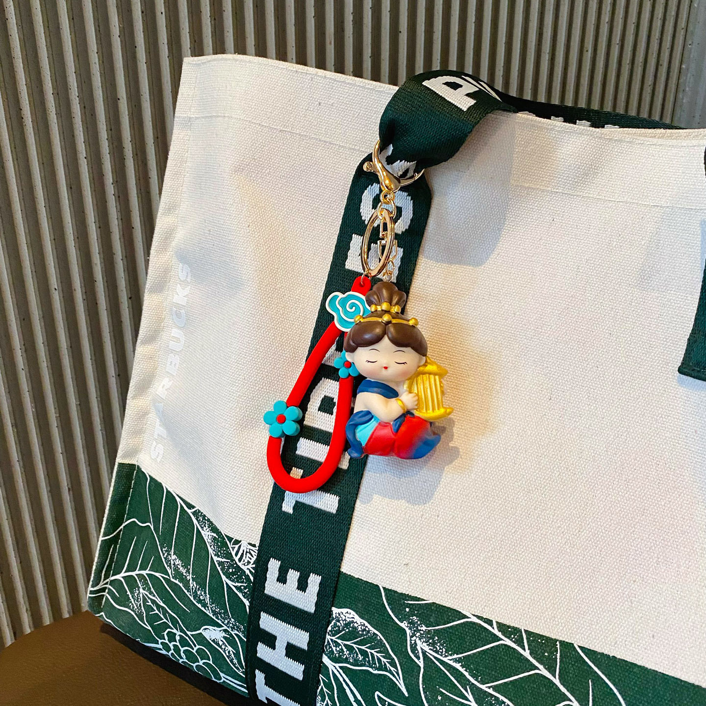 Dunhuang Flying Apsara keychain charm in konghou style hanging on a bag