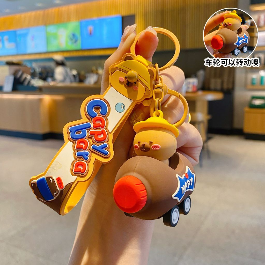 Cute capybara in a brown cola bottle car keychain charm