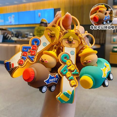 Cute capybara cola bottle car keychain charms in brown and turquoise