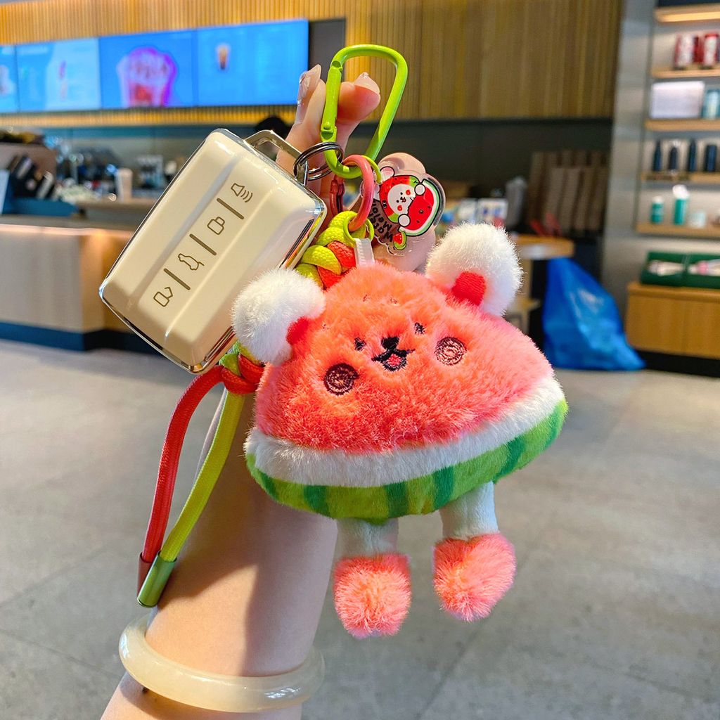 Cute watermelon rabbit plush keychain charm attached to a car key fob