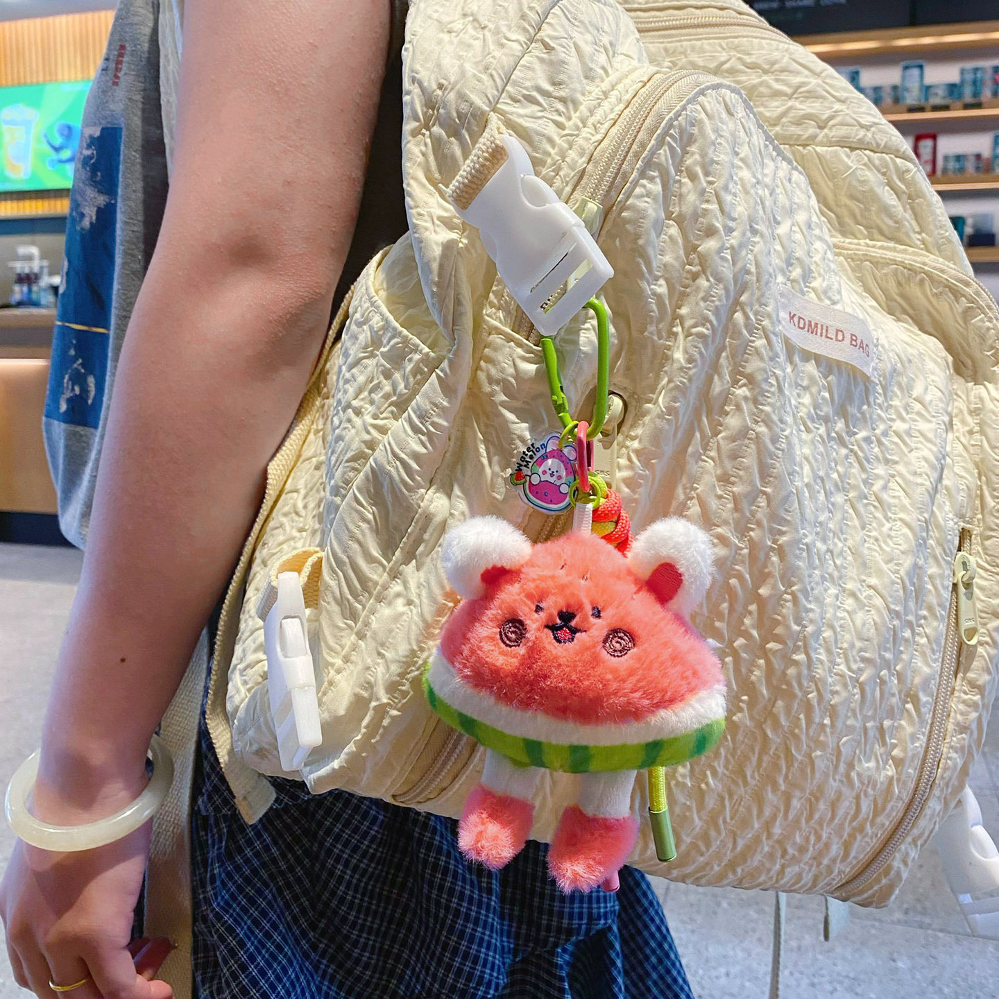 Cute watermelon rabbit plush keychain charm hanging on a bag