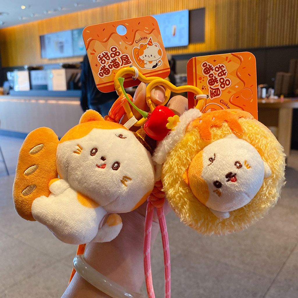 Baguette cat and Swiss roll cat plush keychain charms