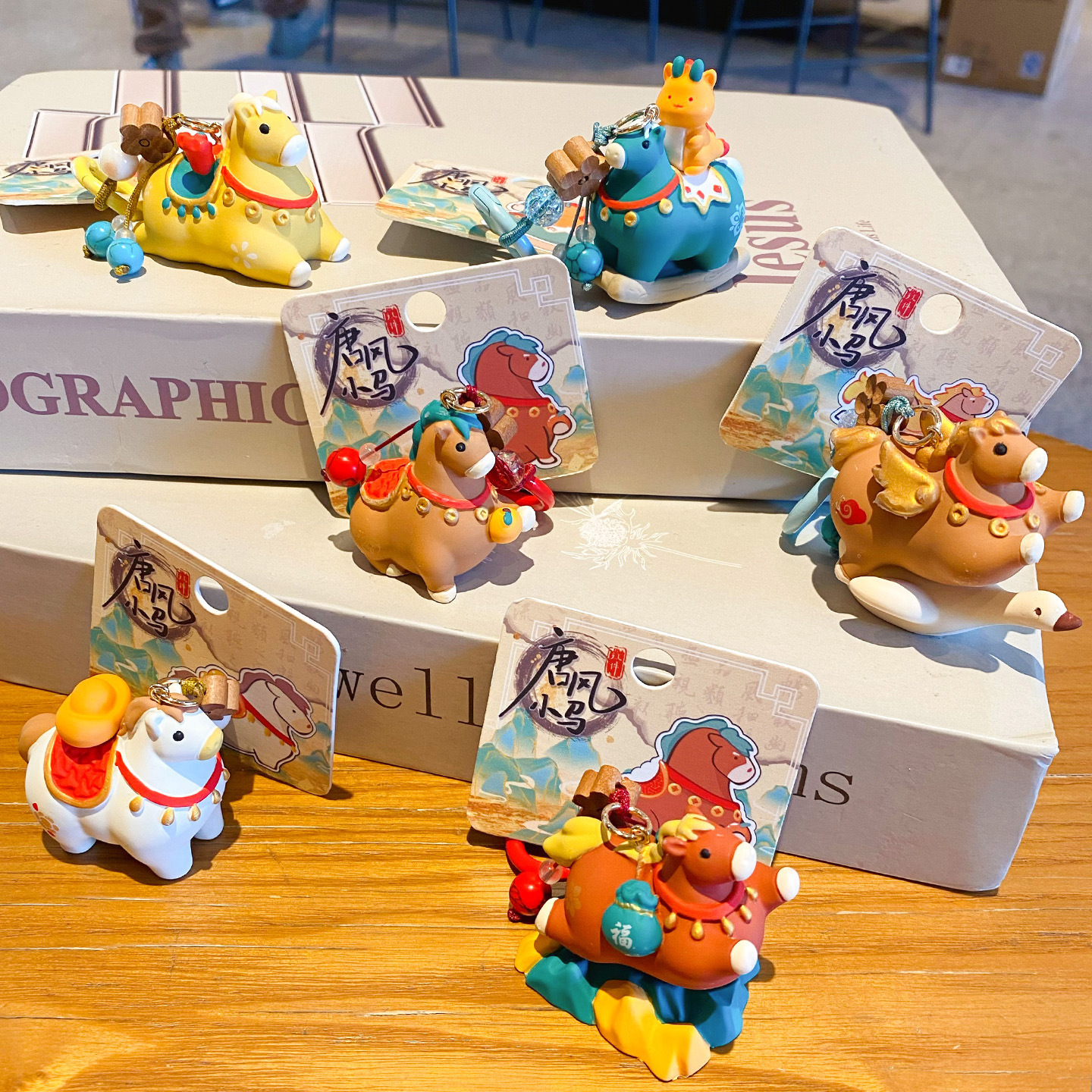 Tang-style lucky pony keychain charms featuring all six designs