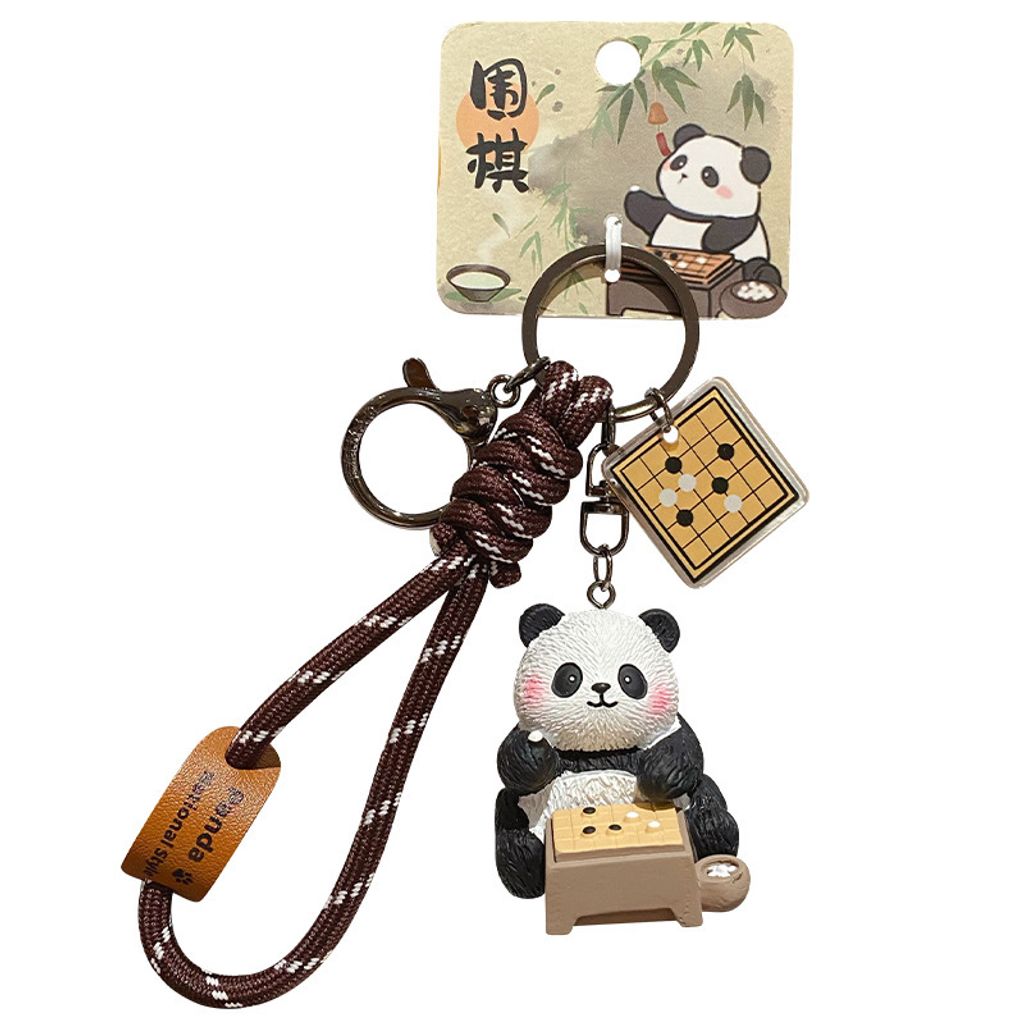 Go-playing panda keychain charm with traditional refined arts design on white background