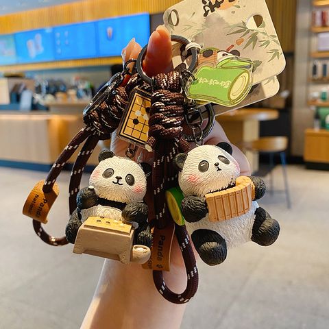 Go-playing panda and calligraphy panda keychain charms with traditional refined arts designs