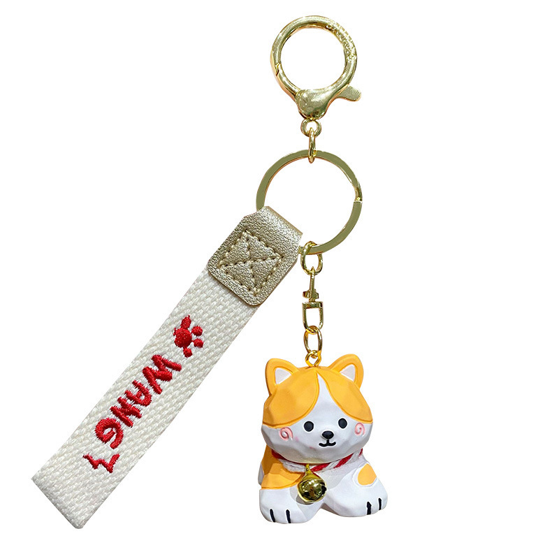 Corgi keychain charm in wood carving style