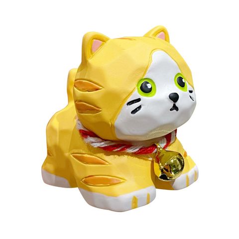 Orange tabby cat mini figurine in wood-carving style on white background