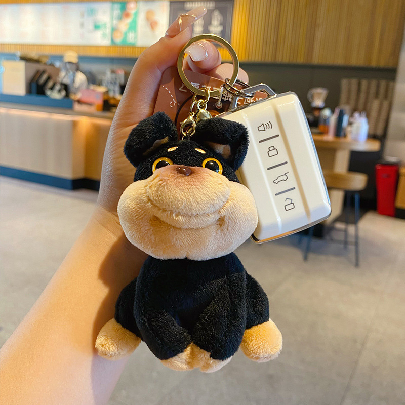 Bee dog plush keychain charm attached to a car key fob