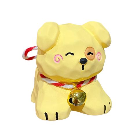 Yellow puppy mini figurine in wood carving style on white background