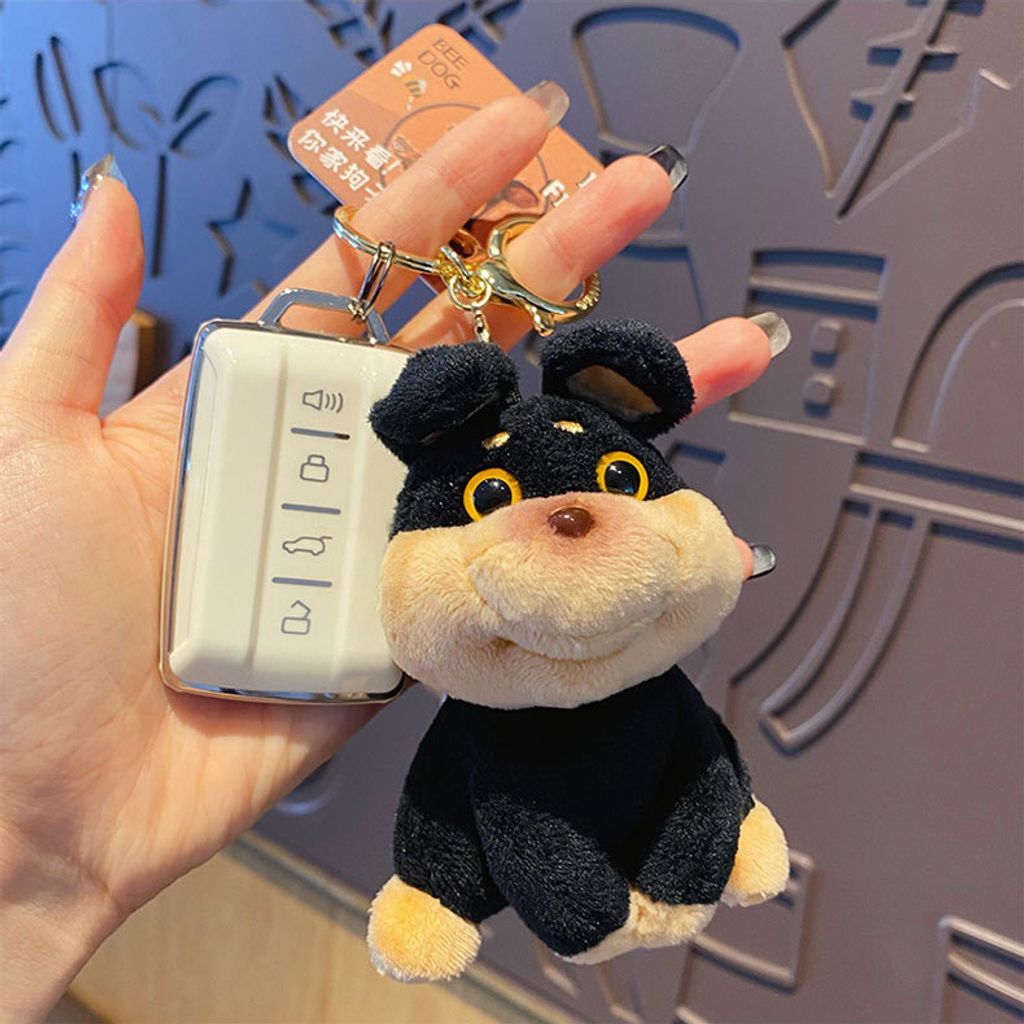 Bee dog plush keychain charm attached to a car key fob