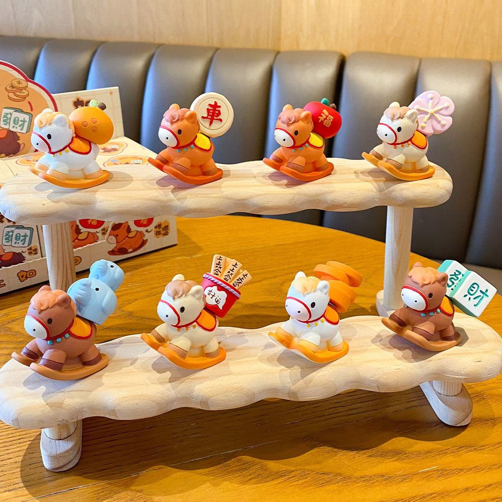 All eight designs of the wish-granting rocking horse mini figurines