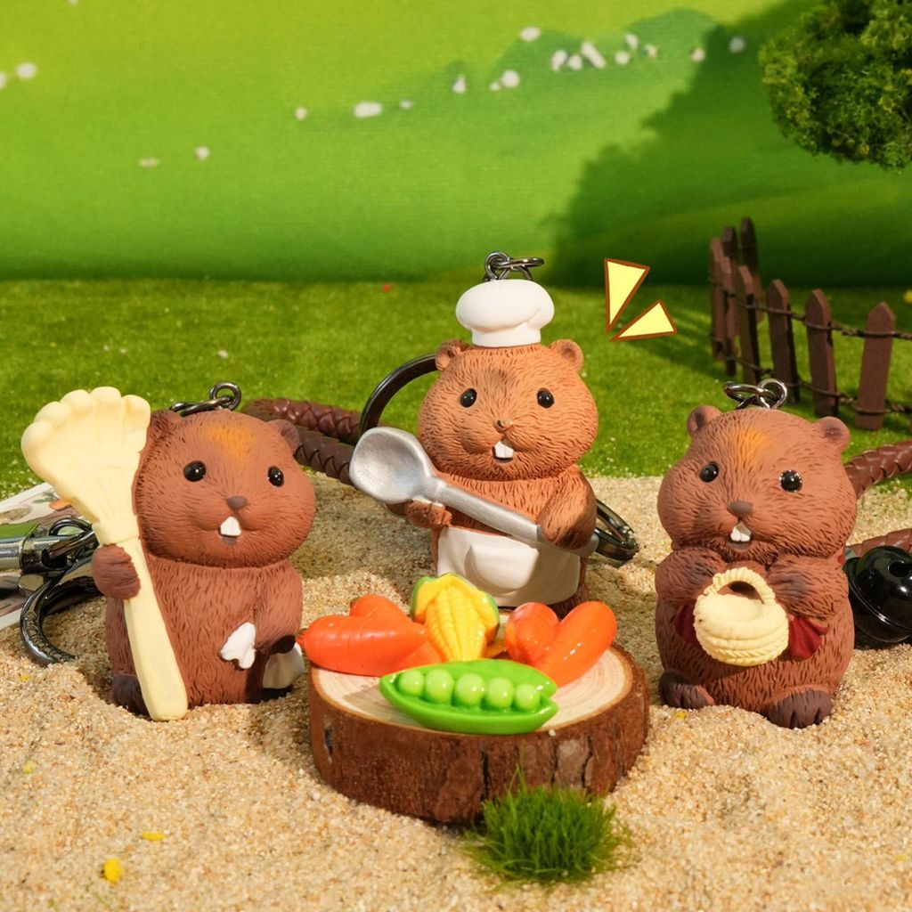 Three groundhog country life keychain charms featuring gardener, chef, and harvester designs