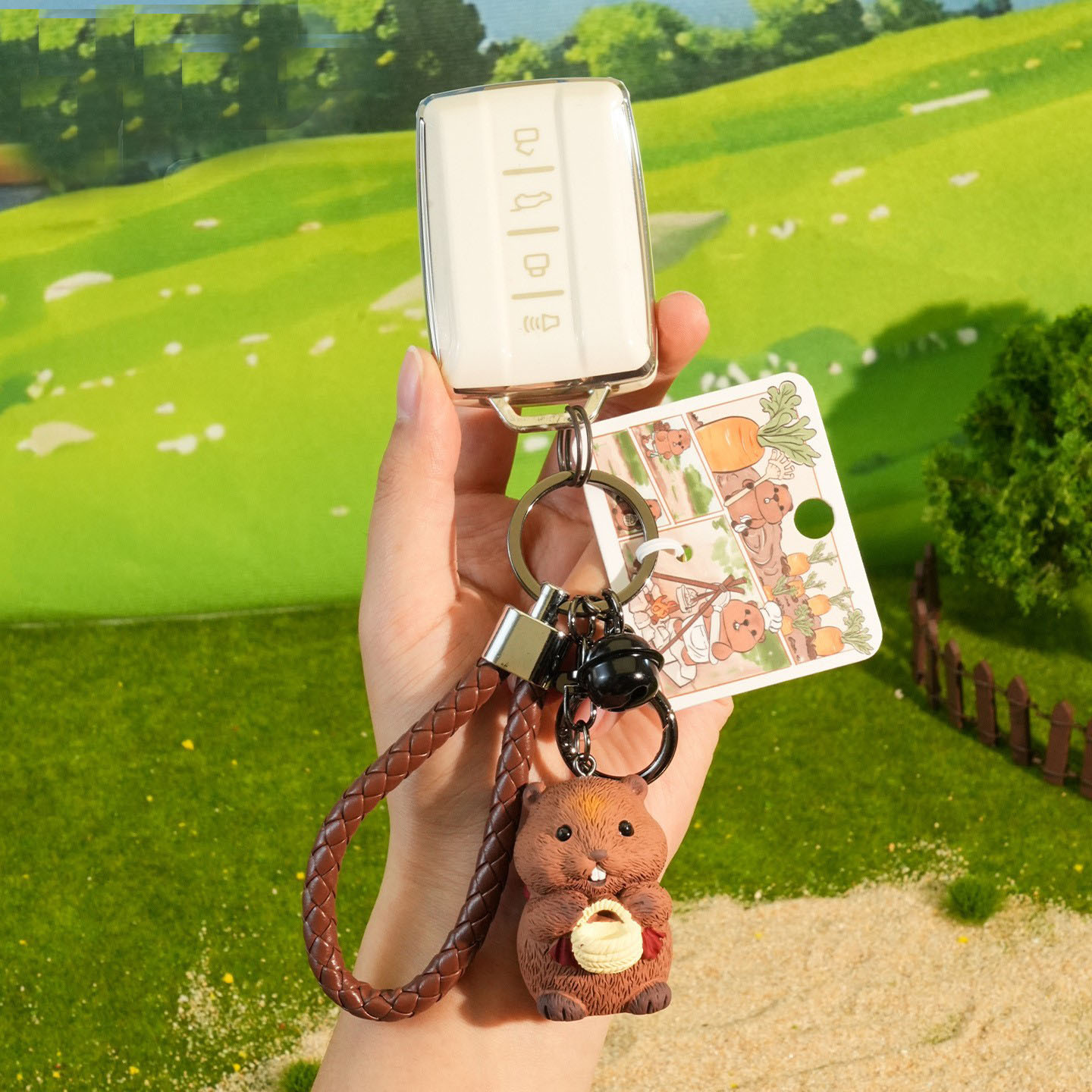 Little harvester groundhog keychain charm attached to a car key fob