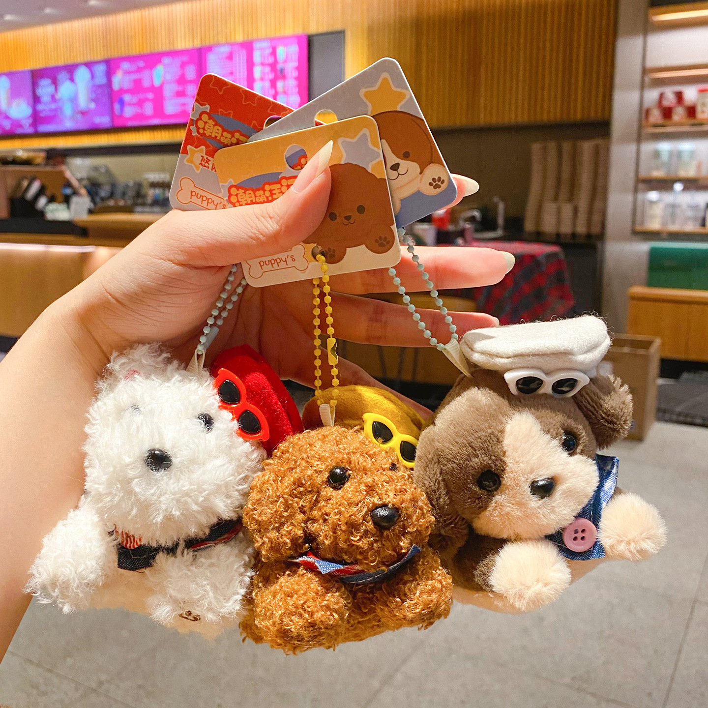 Kawaii puppy plush keychain charms showing various dog designs
