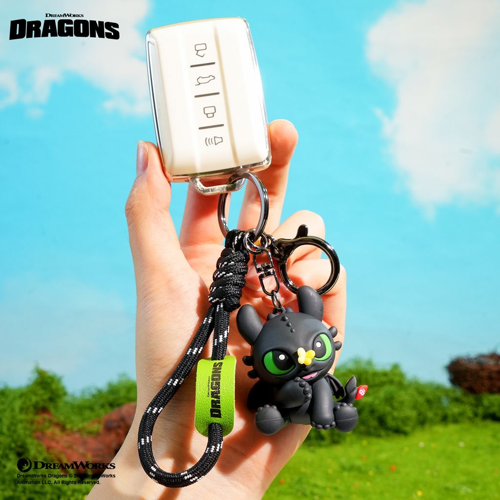 Toothless with butterfly 3D keychain charm attached to a car key fob