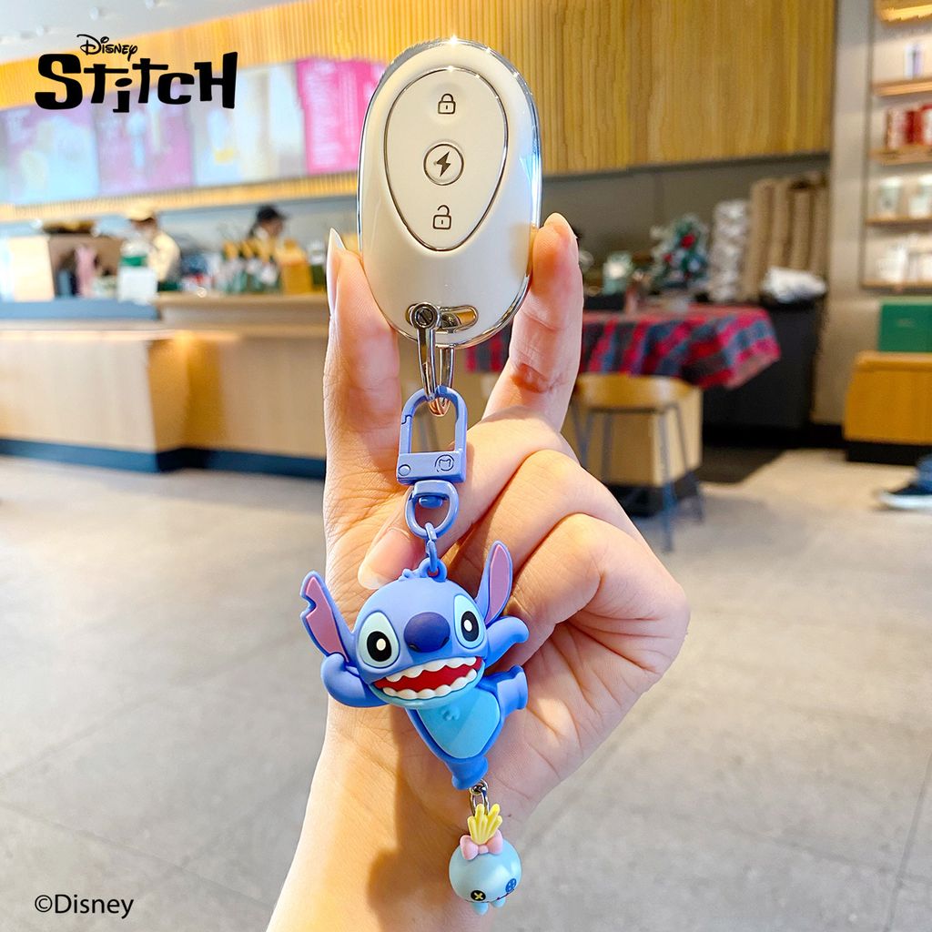Dancing Stitch keychain charm from the Stitch Playful Pals series attached to a car key fob