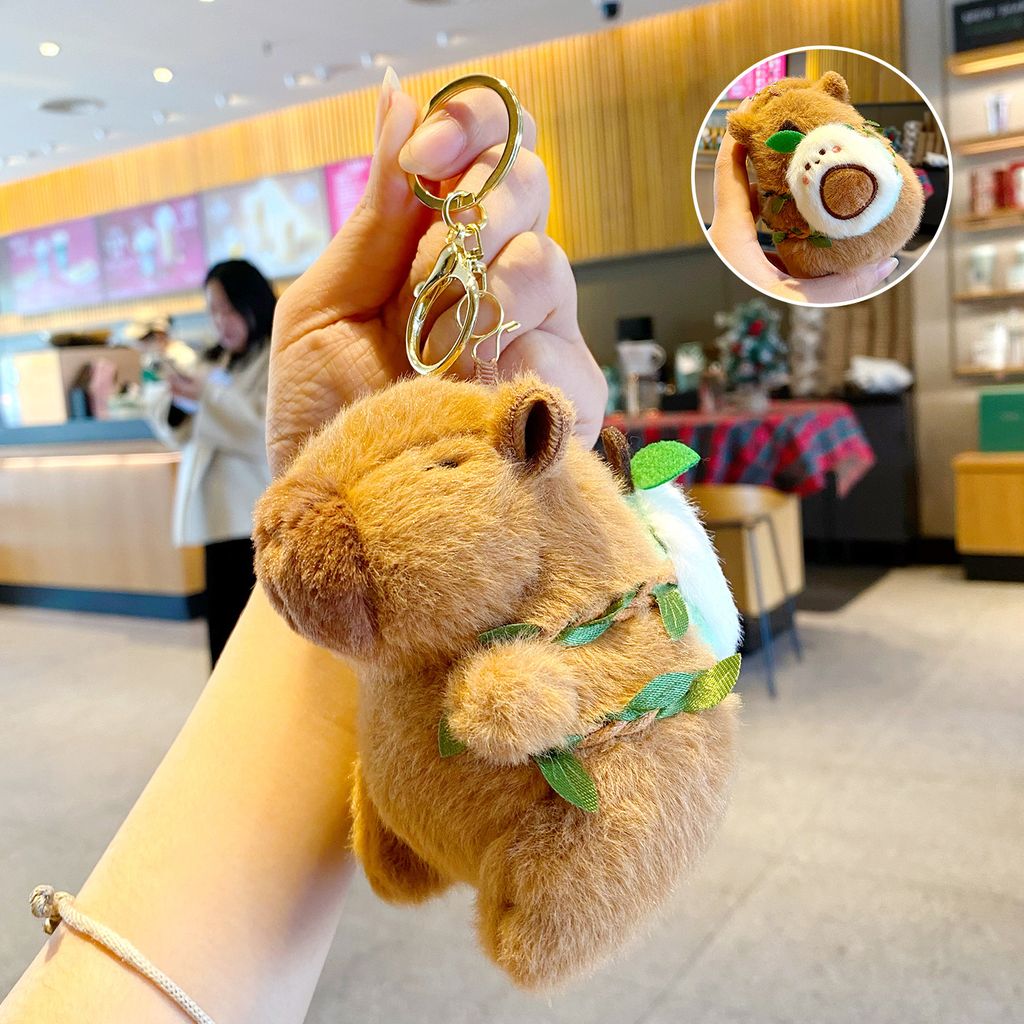 Cute capybara plush keychain with avocado fruit backpack