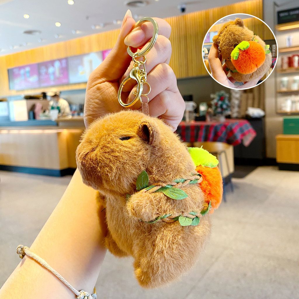 Cute capybara plush keychain with orange fruit backpack