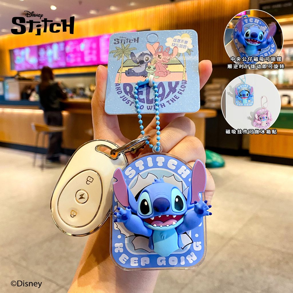Stitch magnetic spinning keychain charm attached to a car key fob
