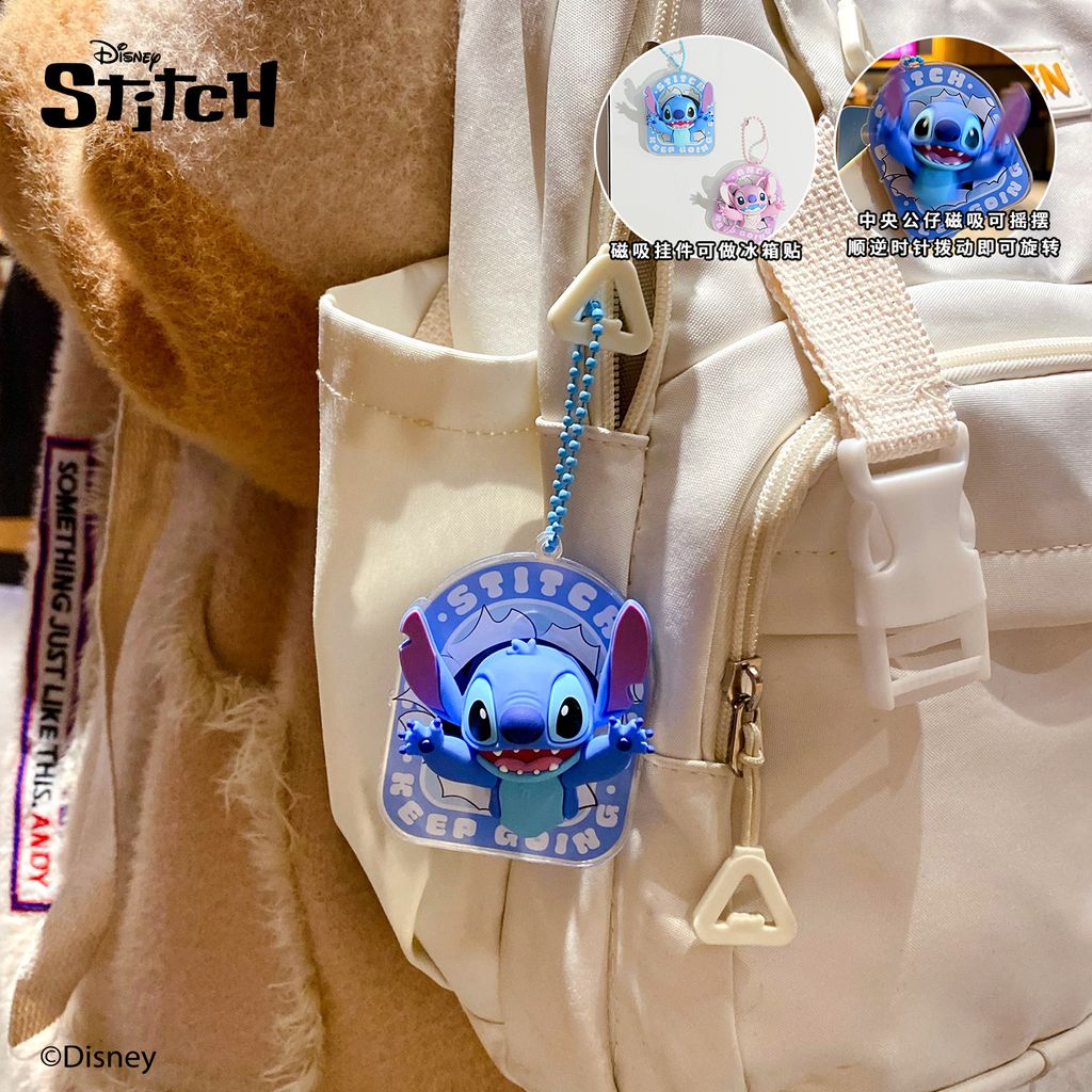 Stitch magnetic spinning keychain charm hanging on a bag