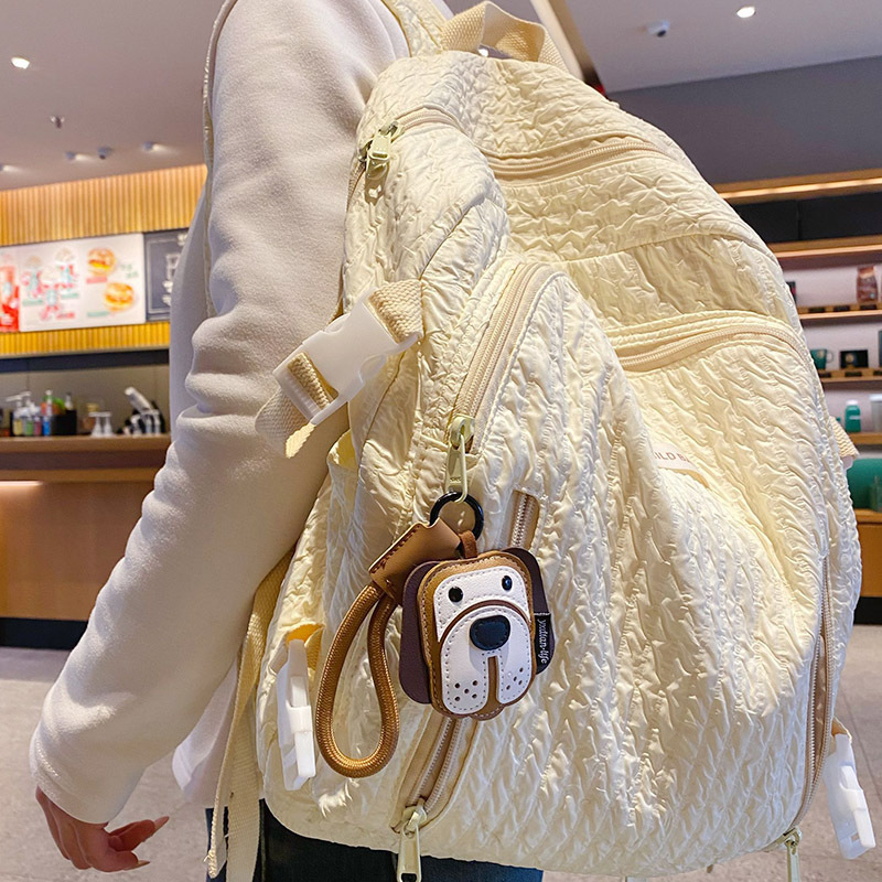 Beagle leather dog keychain charm hanging on a bag