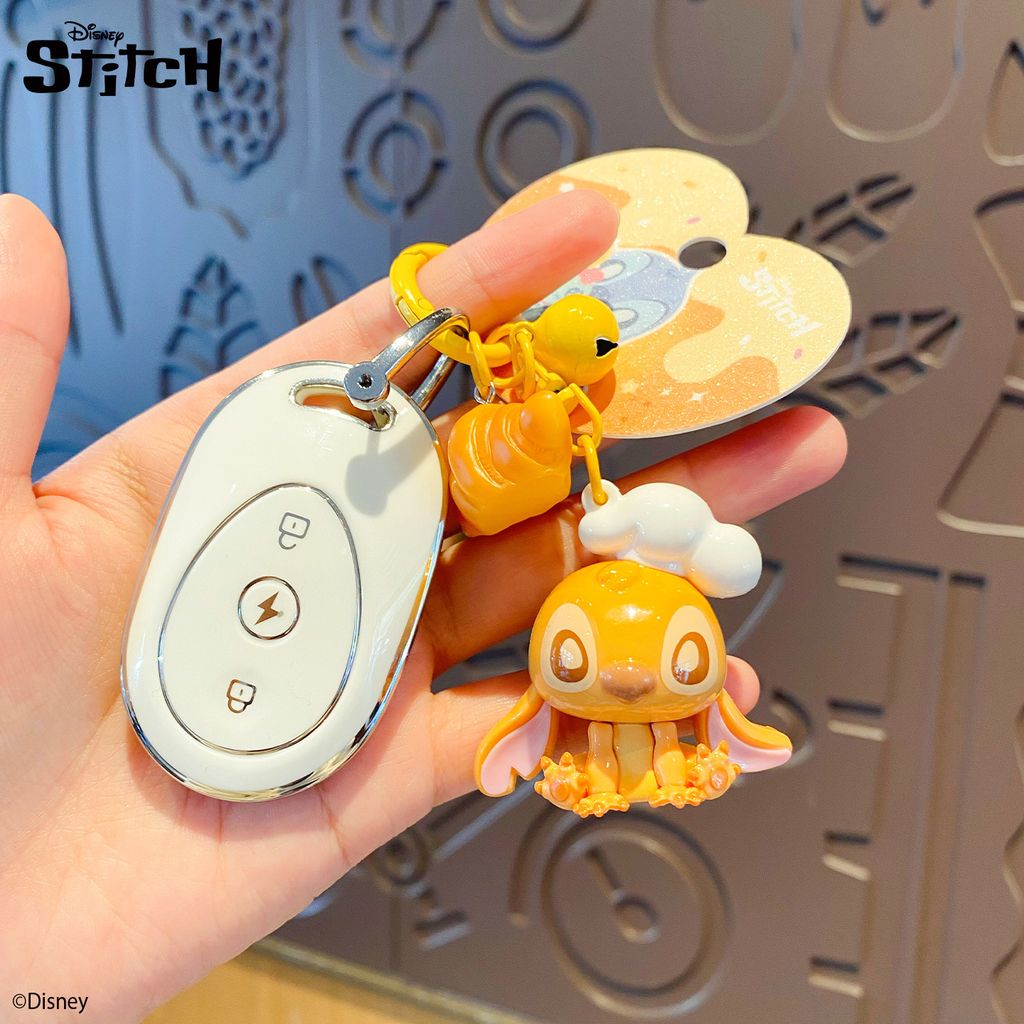 Stitch bakery keychain charm attached to a car key fob