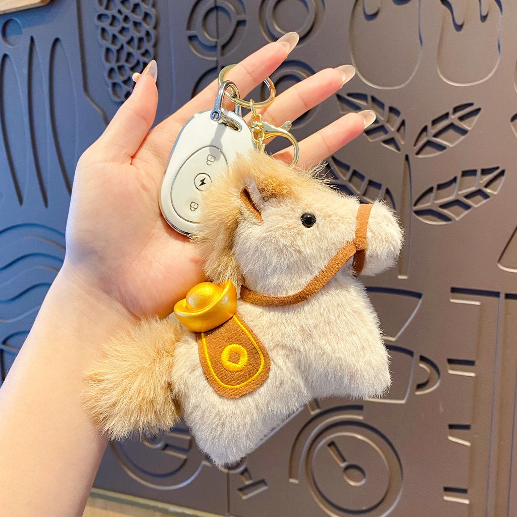 Lucky money on the way plush brown horse keychain charm attached to a car key fob
