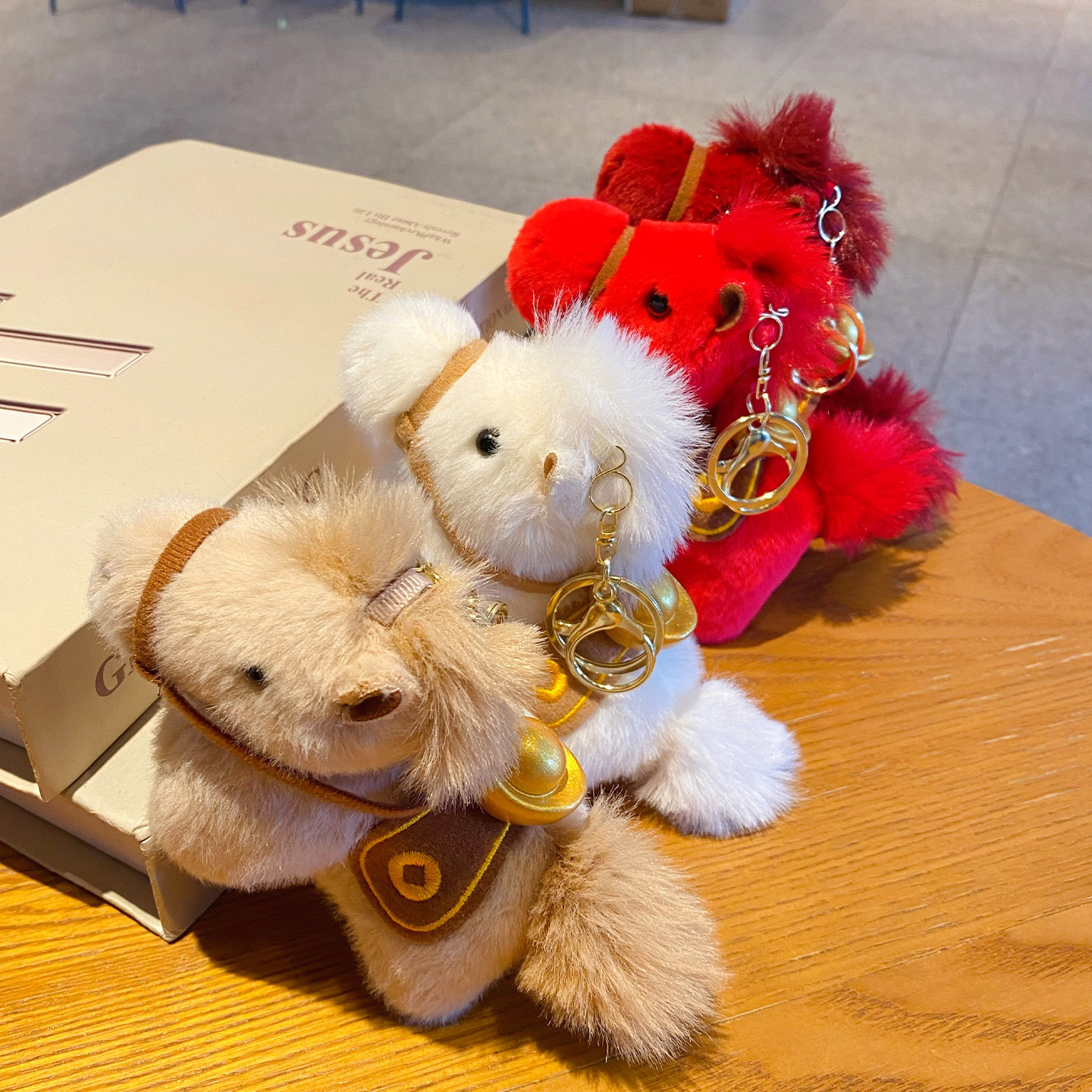 Lucky money on the way plush brown, white, red, and burgundy horse keychain charms