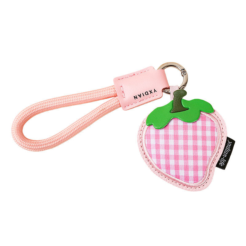 Strawberry gingham leather keychain charm on white background