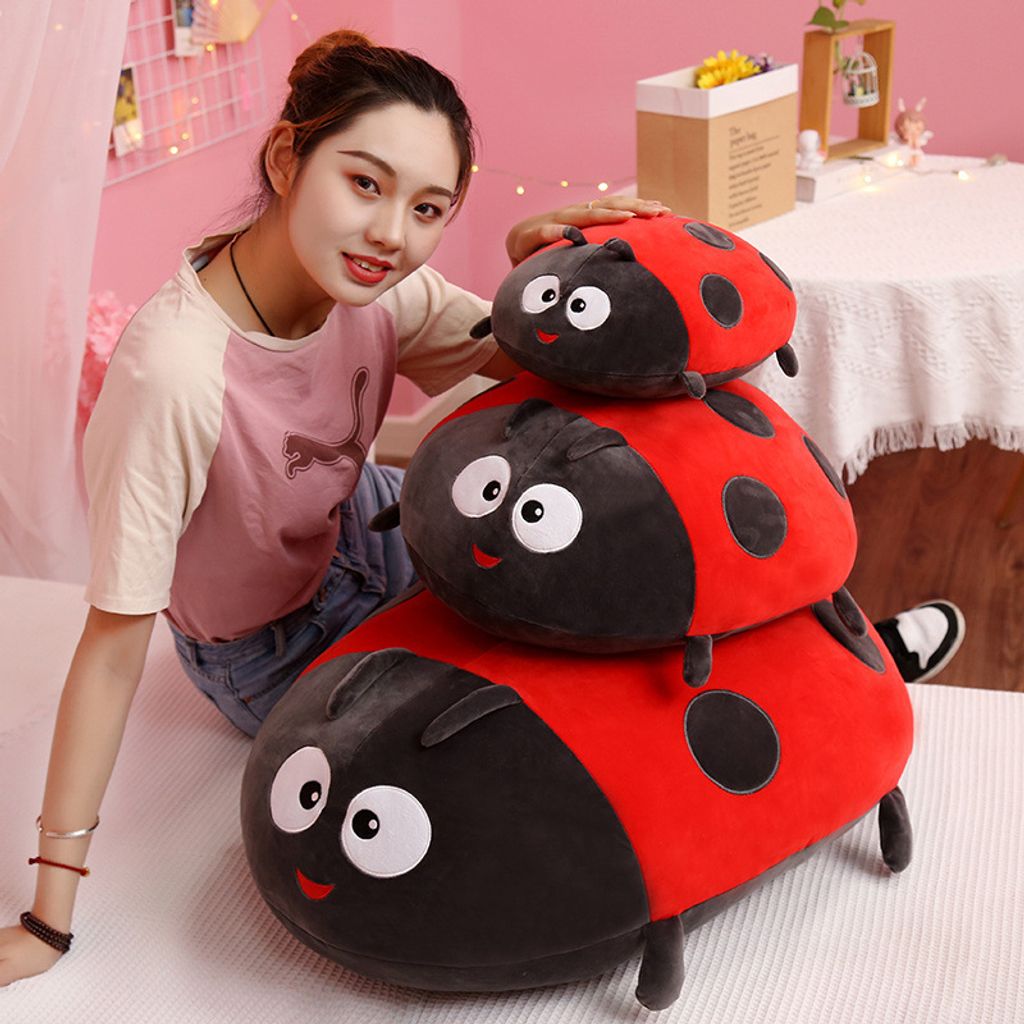 Bee and ladybug plush pillow shown in three sizes