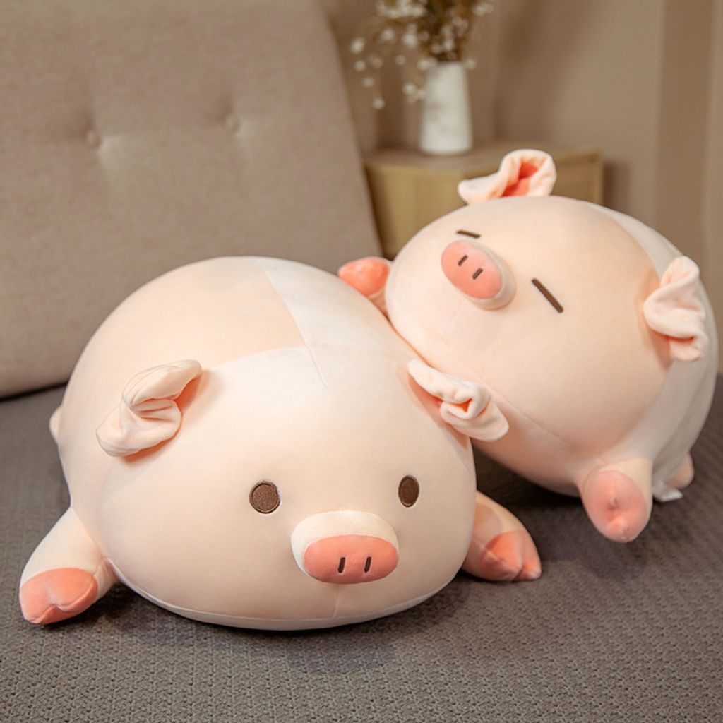 Cute bobo pig plush pillow on bed