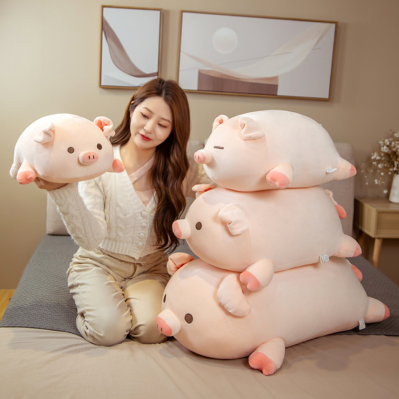 Cute bobo pig plush pillow shown in multiple sizes