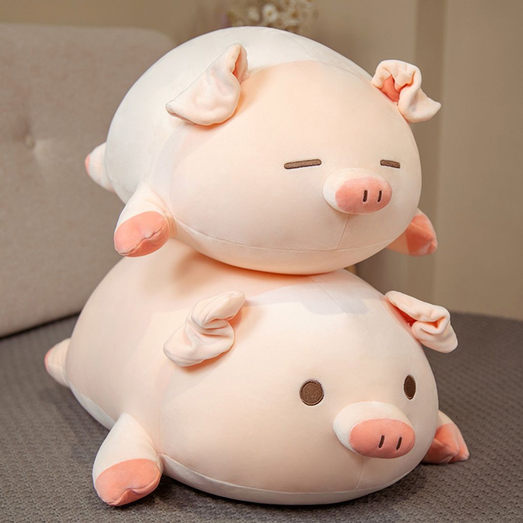 Cute bobo pig plush pillow on bed