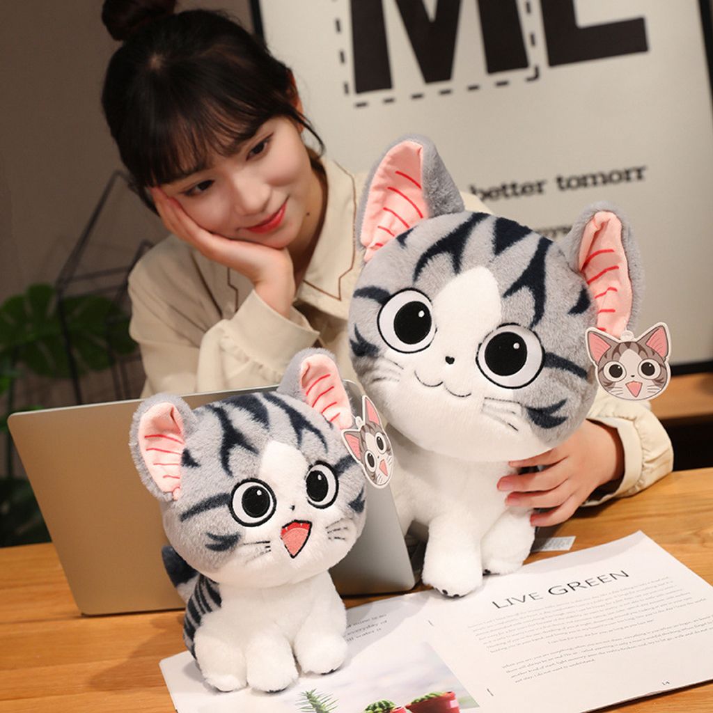 Chi’s Sweet Adventure cat plush toy for hugging and lounging on a table