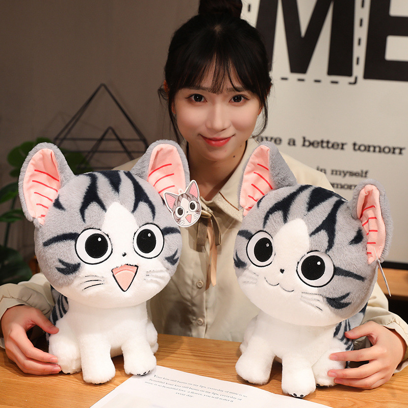 Chi’s Sweet Adventure cat plush toy for hugging and lounging on a table