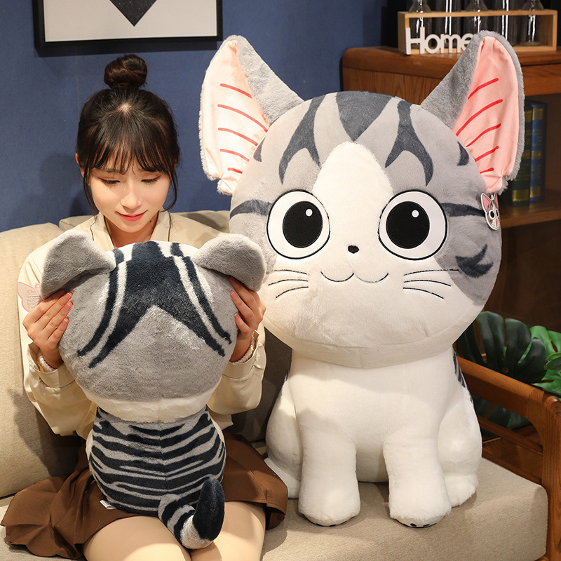 Chi’s Sweet Adventure cat plush toy for hugging and lounging on a sofa