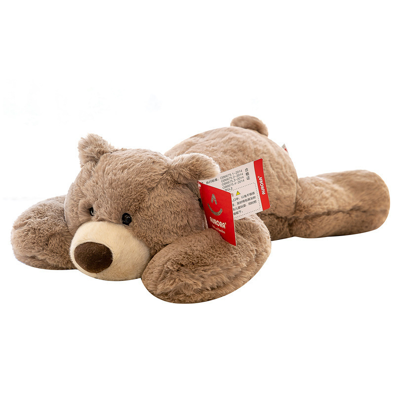 Brown bear lying plush toy on white background