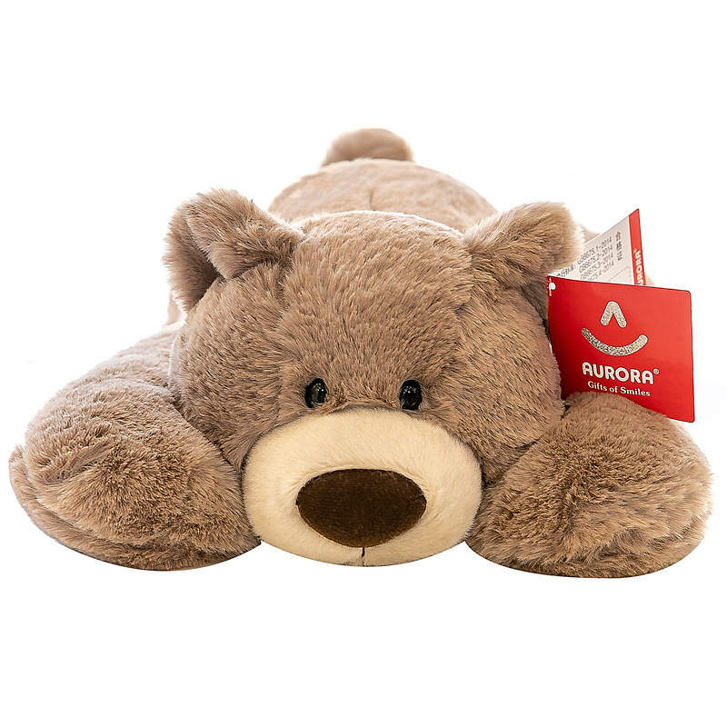 Brown bear lying plush toy on white background