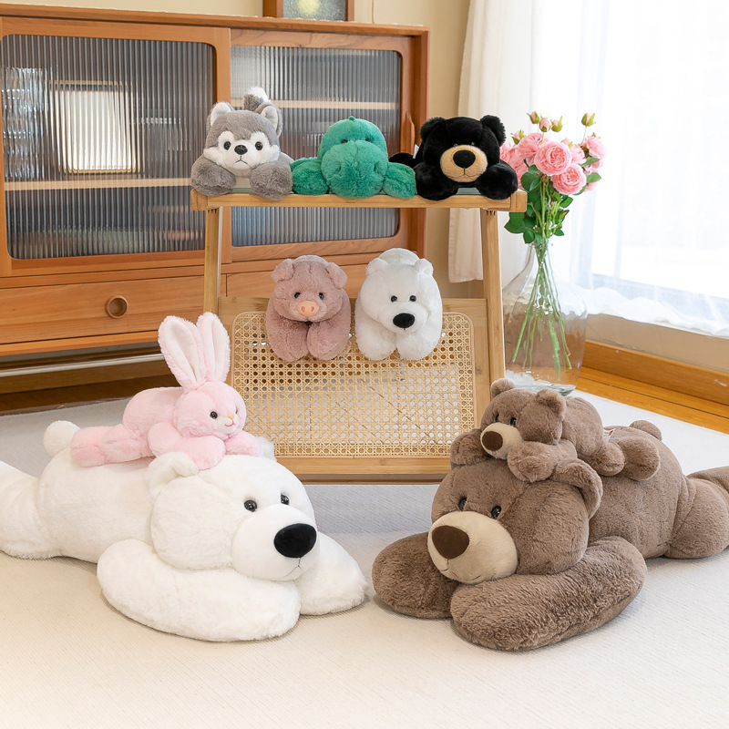 Animal lying plush toy series arranged on a wooden shelf