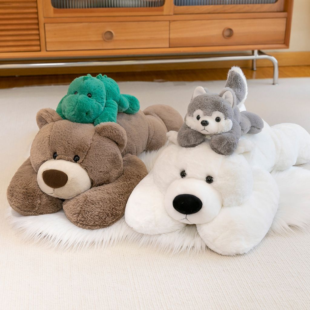 Lying plush toys stacked together showing size and softness