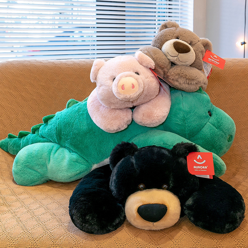 Lying plush toy series stacked together in a cozy setting