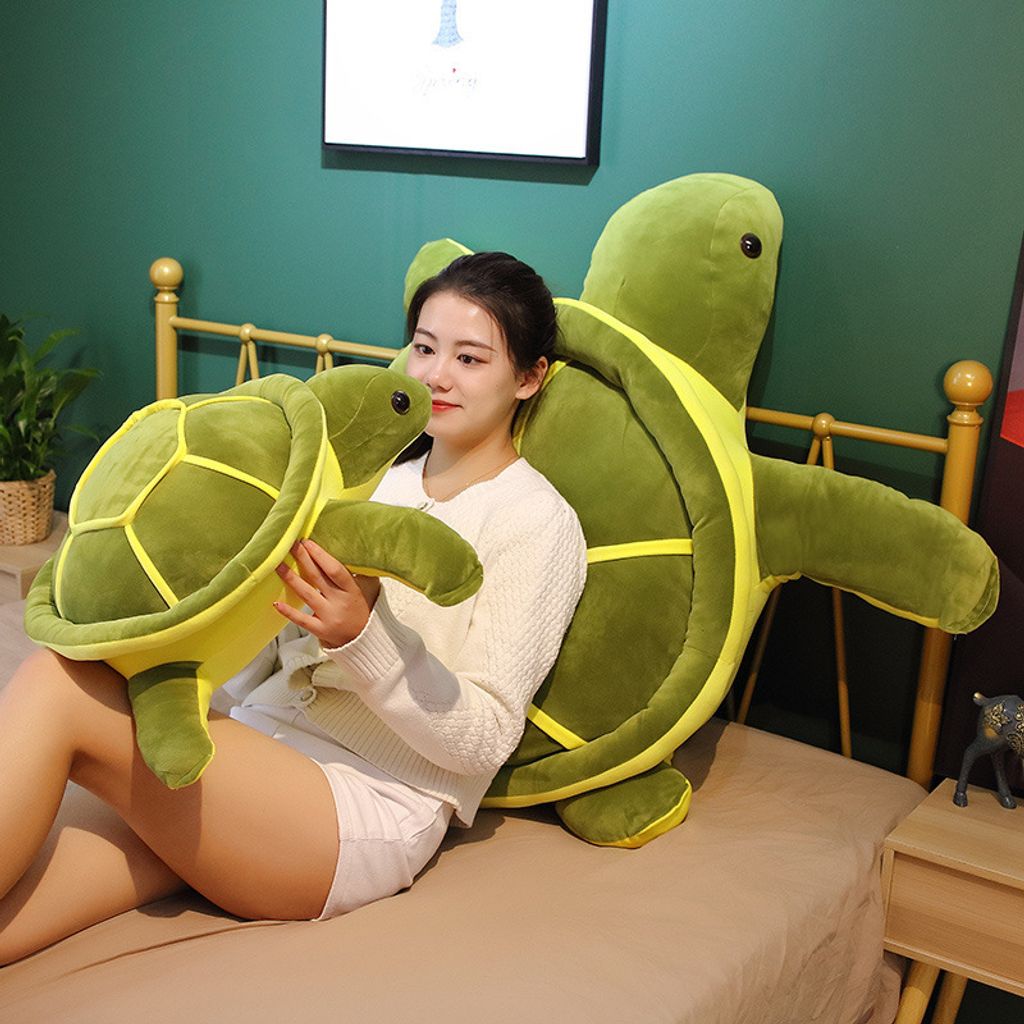 Giant turtle plush pillow for hugging and relaxing on a bed